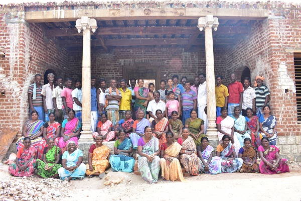 Jawahar (wearing white, at the centre)with the masons who have been helping him in the construction process
